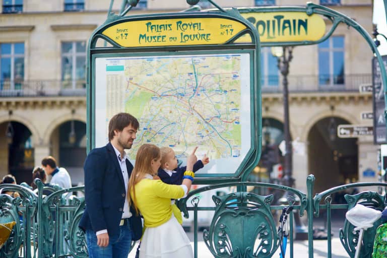 Family in Paris, looking at subway map